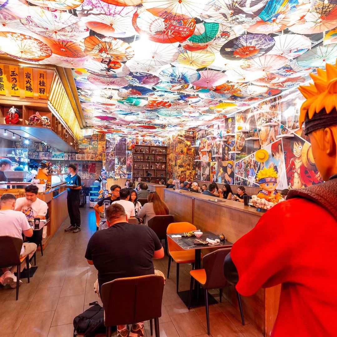 Vibrant and lively interior of Manga Bistro in Montreal, an anime-themed sushi restaurant.