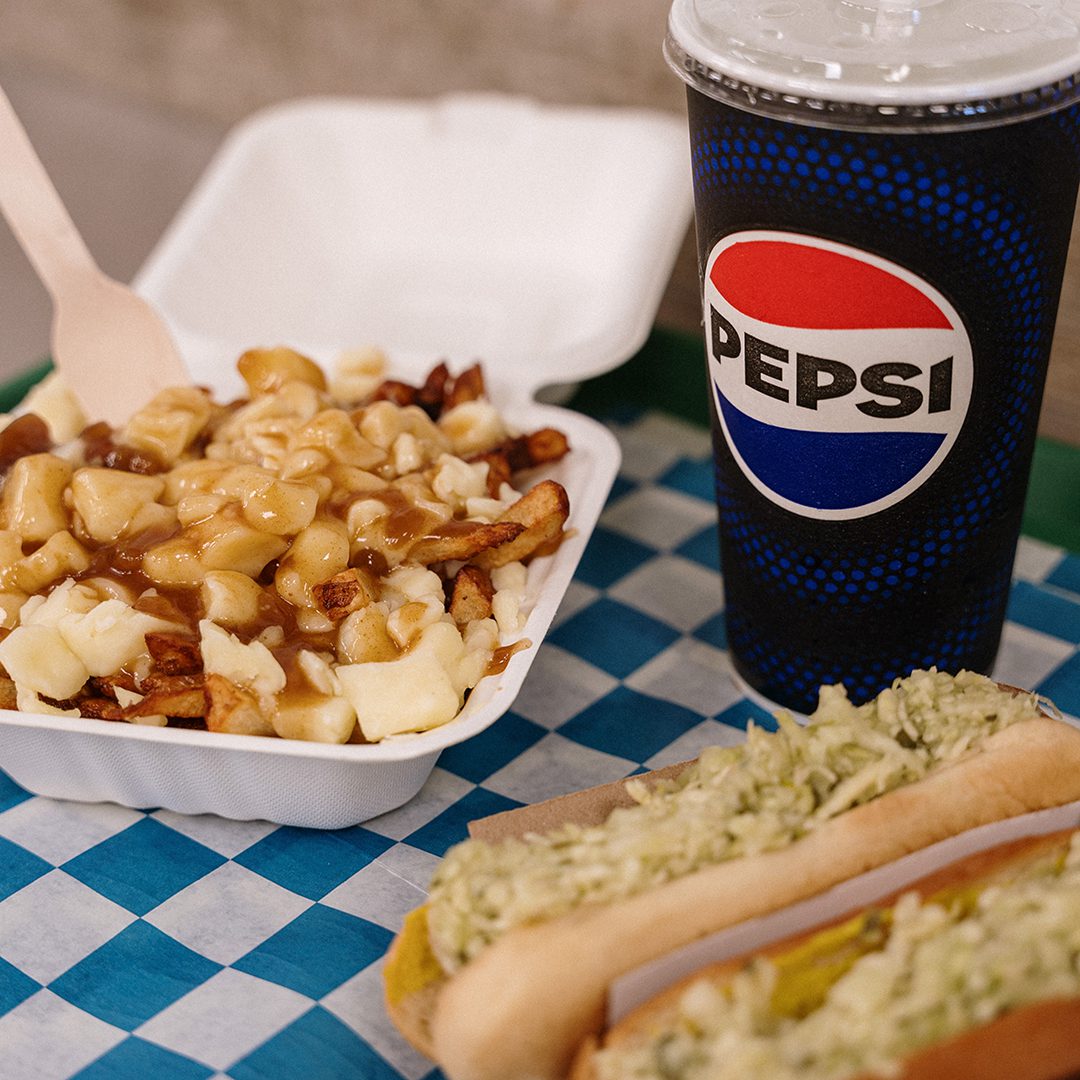 Poutine and hot dogs with a Pepsi drink at Mont Hot-Dog.