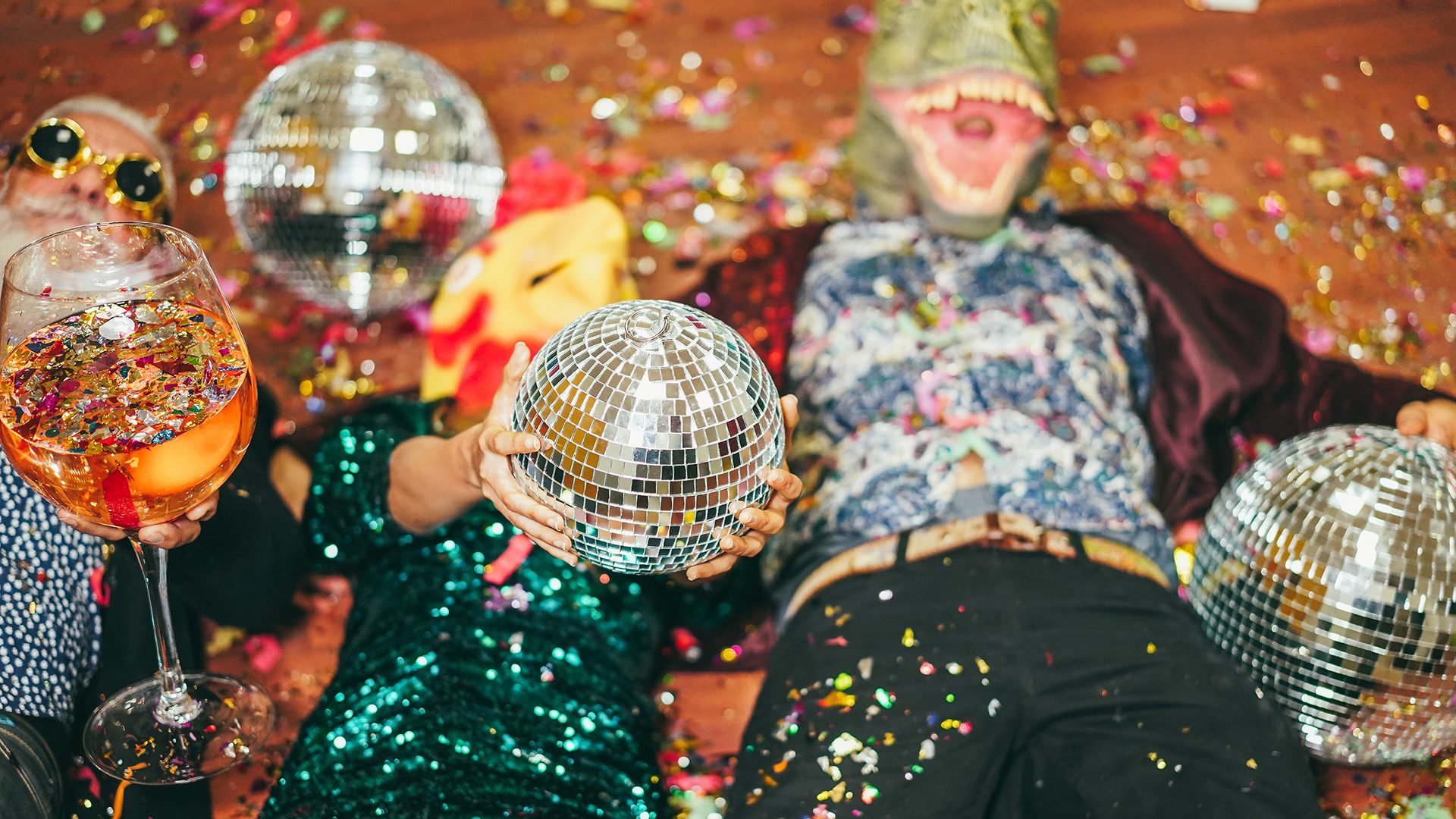 Costumed people dancing with disco balls at Montreal Halloween Party at Jet Night Club