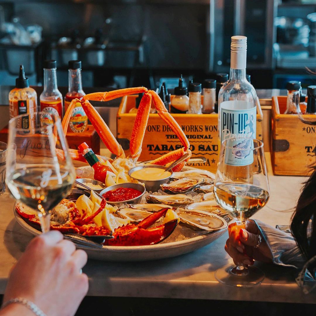 Seafood platter with crab and oysters, white wine.