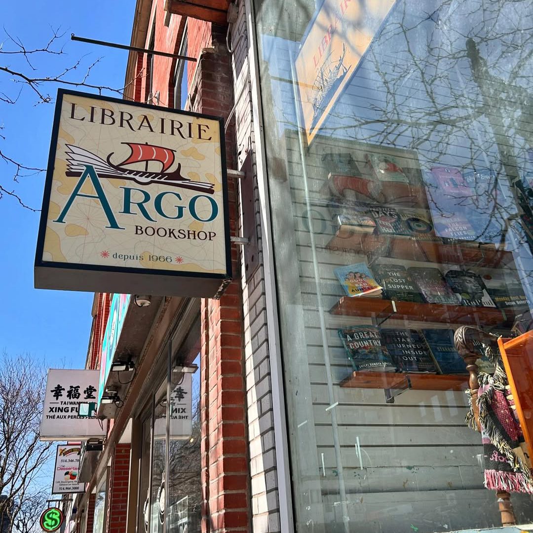 Argo Bookshop’s storefront featuring its historic sign and a window filled with books.